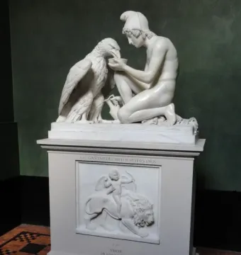Ganymede with Jupiter\'s Eagle marble sculpture of a kneeling youth offering a bowl to an eagle