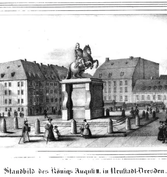 The Golden Rider equestrian statue on a tall pedestal in a busy urban square, with buildings and pedestrians around it.