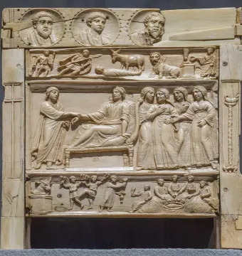 Brescia Casket with richly carved relief panels showing figures, animals, and medallions.
