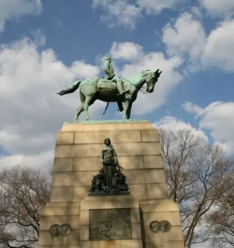 Sherman Monument with a bronze equestrian statue on a tall stone pedestal, flanked by sculptural figures and relief panels.
