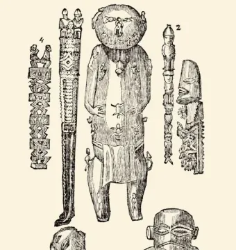 A\'a, a carved Polynesian wooden idol covered with many small figures and abstract motifs, with a large round head and draped lower section.