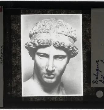 Black-and-white photograph of the head and upper torso of Athena Lemnia, with wavy hair held by a band.