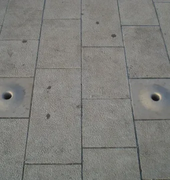 Stone tiles with two circular openings at the Sea Organ in Zadar