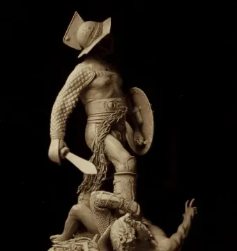 The Gladiators sculpture showing an armored fighter standing over a defeated opponent on the ground.