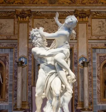 Bernini\'s Rape of Proserpina marble sculpture showing Pluto carrying a struggling Proserpina beside Cerberus