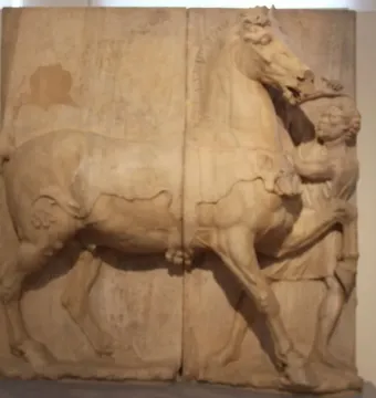 Attic funerary relief showing a large horse in profile with a small groom reaching toward its head.