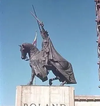King Jagiello Monument, an equestrian bronze statue of a armored figure holding a sword aloft, with a Polish flag behind it and the word POLAND on the pedestal.