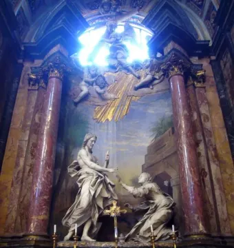 Noli Me Tangere marble sculpture of a cloaked man recoiling from a kneeling woman inside an ornate church interior.