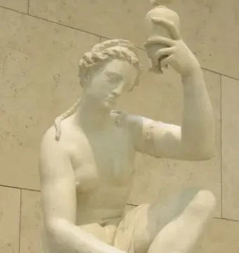Giambologna female figure seated, holding a small vessel and touching her foot.