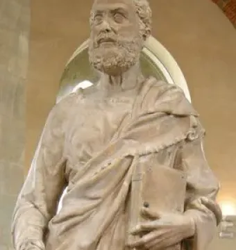 Saint Peter stone statue holding a book and keys.