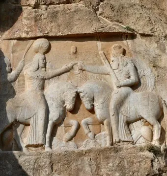 Ardashir Investiture Relief carved into a cliff face, showing two mounted figures facing each other and exchanging a ring.