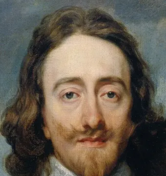 Bust of King Charles I with long wavy hair, a mustache, and a pointed goatee, wearing a lace collar.