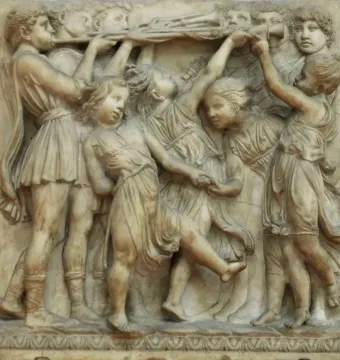 Cantoria marble relief showing young figures singing and dancing with musical instruments.