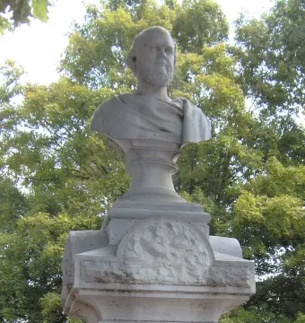Beriah Magoffin Monument showing a stone bust of a bearded man on an ornate pedestal with a circular relief carving.