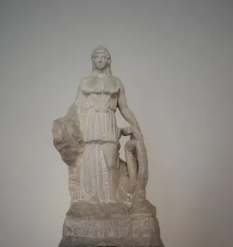 Lenormant Athena marble statuette of a draped female figure holding a shield-like object.