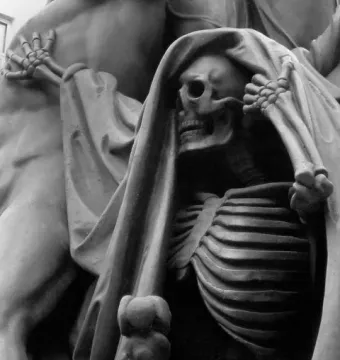 Skeletal figure from the Nelson Monument with a raised hand and flowing drapery beside a muscular form.