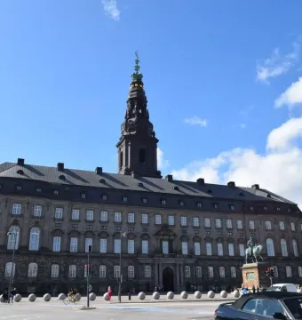 Frederick VII equestrian monument on a stone pedestal in front of Christiansborg Palace in Copenhagen.