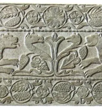 Plutei of Theodota carved stone relief with winged lion-like creatures flanking a central plant motif and surrounded by ornate decorative borders.