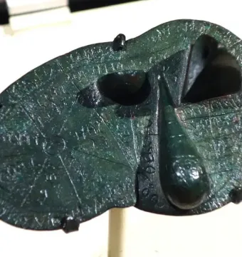 Bronze Liver of Piacenza with engraved lines, inscriptions, and uneven raised sections.