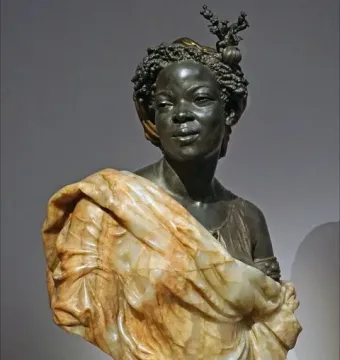 Bust of Woman from the French Colonies showing a dark-skinned female figure with curled hair, a small headpiece, and draped fabric.
