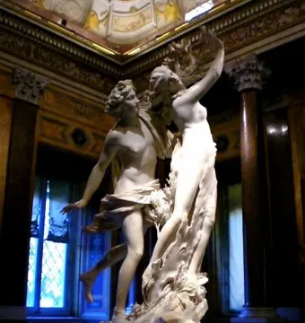 Bernini’s Apollo and Daphne marble sculpture showing Apollo lunging toward Daphne as she transforms into a tree.