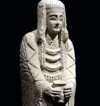 Lady of Cerro de los Santos statue holding a small vessel at chest level