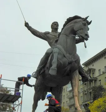 Pyotr Bagration Monument with workers maintaining the bronze equestrian statue on its stone pedestal