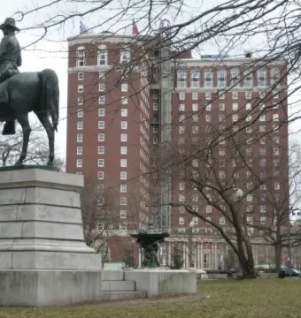 Ambrose Burnside Monument, a bronze equestrian statue on a stone pedestal in an urban park.