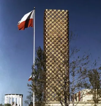 King Jagiello Monument beside a tall gold-toned pavilion with a Polish flag in front of it
