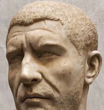 Marble bust of Philip the Arab with short textured hair and a closely cropped beard.