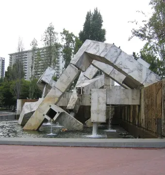 Vaillancourt Fountain with rough concrete forms and flowing water in an urban plaza.