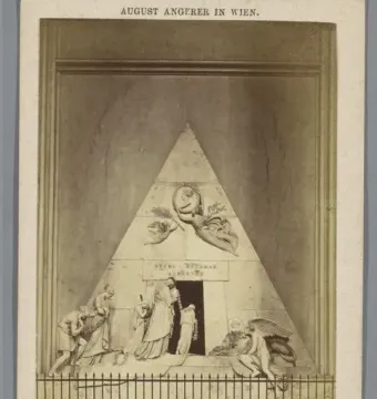 Cenotaph of Archduchess Maria Christina, a pyramidal marble monument with sculpted figures and a winged figure above a dark entrance.