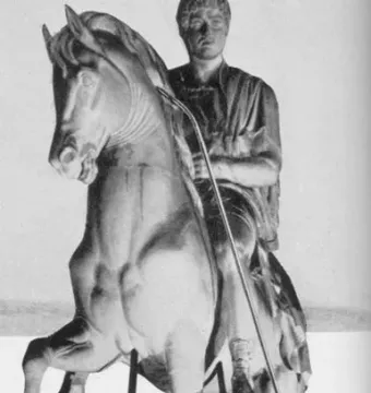 Prince Józef Poniatowski Monument with a man cleaning the rearing horse statue beside its foreleg.