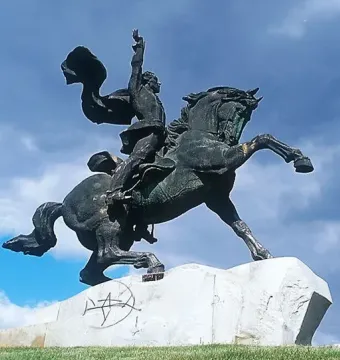 Suvorov Monument depicting a bronze equestrian statue of a man on a rearing horse with one arm raised.
