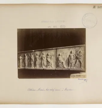 Mantineia Base with three carved relief panels showing classical figures, including a lyre player.