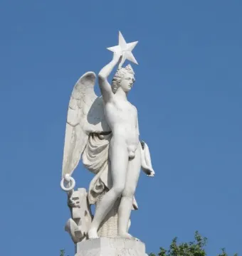 Winged marble statue of the Genio Catalán holding a star above its head