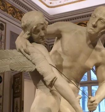 Daedalus and Icarus marble sculpture by Antonio Canova, showing an older man fitting wings onto a younger man.