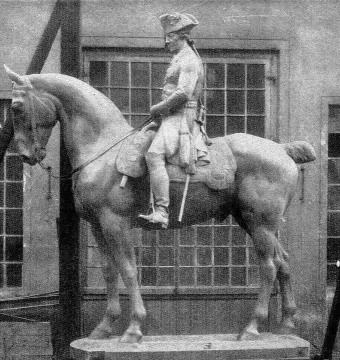 The Equestrian Monument of Frederick the Great shown as a large equestrian statue on a simple base in front of a building with many windows.