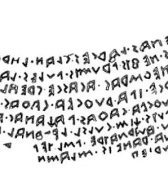 Inscription on the Sarcophagus of Laris Pulenas, shown as several lines of angular carved characters on a white background.