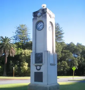 Edith Cowan Memorial stone clock tower with a bronze bust and plaque.