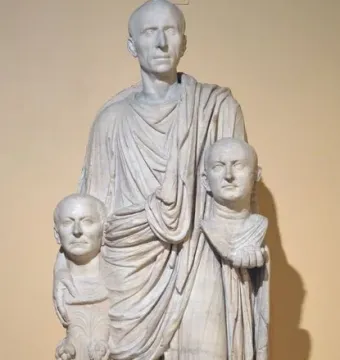 Togatus Barberini, a marble statue of a standing man in flowing robes holding two sculpted heads.