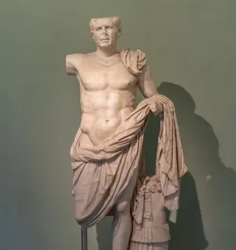 The General of Tivoli marble sculpture, showing a shirtless male torso with draped cloth and missing right arm and lower right leg.