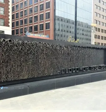 Holodomor Memorial bronze relief with wheat stalks and the inscription 1932-1933