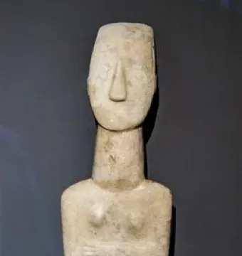 Kykladic Idol marble female figurine with folded arms and elongated head