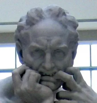 Close-up of Ugolino and His Sons showing a white marble figure with a deeply distressed expression and clenched hands at his face.