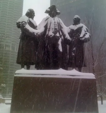 Heald Square Monument statue dusted with snow during heavy snowfall