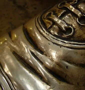 Close-up of the polished shoe toe on the Timothy Eaton statue.