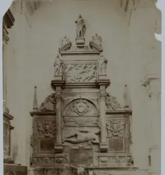 Sepia-toned view of the Tomb of Lew Sapieha, a multi-tiered funerary monument with sculptural figures, reliefs, coats of arms, and inscription plaques.