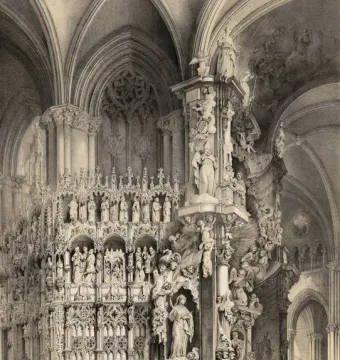 The Transparente altar in Toledo Cathedral, shown as a highly ornate altarpiece beneath a vaulted ceiling with a crowd gathered below.