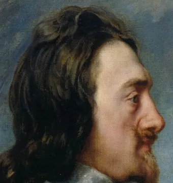 Profile portrait of King Charles I with long dark wavy hair, a pointed goatee, and a white collar.